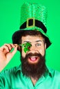 Saint Patrick's Day celebration. Four leafed clover. Patricks Day green shamrock. Happy man in green top hat on