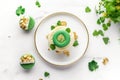 Saint Patrick\'s Day food concept. Top view photo of a green cupcake with a leprechaun hat topper Royalty Free Stock Photo