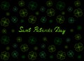 Saint Patrick`s Day greeting card with emerald tender clover leaves and text on black background. Inscription - Saint Patrick`s Da Royalty Free Stock Photo