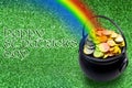 Saint Patrick`s Day and Leprechaun`s pot of gold coins concept with a rainbow indicating where the leprechaun hid treasure on a Royalty Free Stock Photo