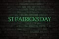 Saint PatrickÃ¢â¬â¢s Day neon sign. Neon lettering st Patricks day on brick wall