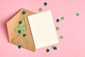 Saint Patricks day greeting card mockup with green paper shamrock on pink background Royalty Free Stock Photo