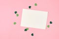 Saint Patricks day greeting card mockup with green paper shamrock on pink background Royalty Free Stock Photo