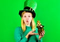 Saint Patricks Day. Irish Traditions. Woman in Leprechaun hat holds pot with gold. St Patrick.