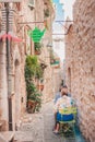 Saint-Paul-de-Vence, Provence / France - September 28, 2018: A couple of tourists in a small cozy cafe Royalty Free Stock Photo