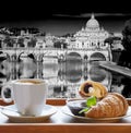 Saint Peter`s Basilica and Tiber river against cup of fresh coffee with croissant in Rome, Italy Royalty Free Stock Photo