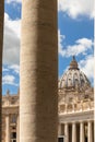 Saint Peter`s Dome seen through the Bernini Colonnade in St. Peter`s Square, Doric column detail.