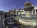 Saint Peter`s Square Bernini Fountain Tourists Vatican Rome Italy. St. Peter`s Basilica, St. Peter`s Square, Vatican City, Rome Royalty Free Stock Photo