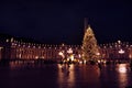 Saint Peter`s square with huge Christmas tree on a December night. Warm tones
