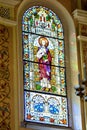 Saint Peter Stained Glass Pane Decorated window in ancient catholic church vitraj Royalty Free Stock Photo