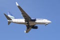 Boeing 737-700 (RA-73263) of Yakutia Airlines flies in the blue cloudless sky Royalty Free Stock Photo