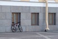 A lone Bicycle leaning against the wall of the Main Headquarters
