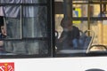 Side view of a Young guy in a mask riding a bus Royalty Free Stock Photo