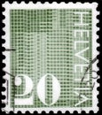 Saint Petersburg, Russia - April 30, 2020: Postage stamp issued in the Switzerland with the image of the Digits 20 on patterned