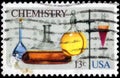 Saint Petersburg, Russia - April 01, 2020: Postage stamp issued in the United States dedicated to the Chemistry. Flasks,