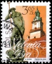 Saint Petersburg, Russia - April 30, 2020: Postage stamp printed in the Poland with the image of the Town Hall and Neptune