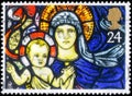 Saint Petersburg, Russia - April 01, 2020: Postage stamp issued in the United Kingdom with the image of the Madonna and Child, St Royalty Free Stock Photo