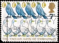 Saint Petersburg, Russia - April 01, 2020: Postage stamp issued in the United Kingdom with the image of Six Geese a laying, Five