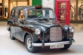 Saint Petersburg, Russia - August 10, 2018: London taxi Austin FX4 and a phone booth in the Mall as a decoration.