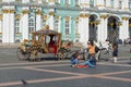 Saint-Petersburg, Russia-August 28, 2021: Young female tourists on the palace square of St. Petersburg are waiting for a ride on a