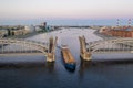 Saint Petersburg. Russia. Bolsheokhtinsky bridge lifted. Bridge of Peter the Great at sunset. The drawbridges of Petersburg. Royalty Free Stock Photo