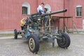 Curious children climbing, playing on a Soviet 85 mm air defense gun M1939 52-K.