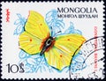 Saint Petersburg, Russia - February 06, 2020: Postage stamp issued in Mongolia with the image of the Brimstone, Gonepteryx rhamni