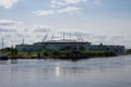 Gazprom arena. A mix of times-a view of the river, on the Bank of which stands an old house, Royalty Free Stock Photo