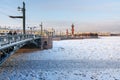 Palace Bridge and Vasilyevsky island Spit Strelka with Rostral columns in winter. Saint Petersburg, Russia Royalty Free Stock Photo