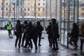 Saint Petersburg, Russia - 31 January 2021: Police in armor brutally detain a man, riot police crowd arrest, Illustrative