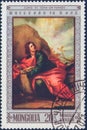 Saint Petersburg, Russia - January 08, 2020: Postage stamp issued in Mongolia with the image of the the painting St John on Patmos