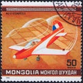 Saint Petersburg, Russia - January 03, 2020: Postage stamp issued in Mongolia with the image of the sports plane MJ-2 Tempete,