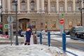 The southerner janitor cleans snow on the Blue bridge near the L Royalty Free Stock Photo