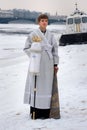 Young churchman on the street on Epiphany day. Saint Petersburg. Russia, Royalty Free Stock Photo