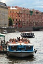 Saint Petersburg, Russia - July 4, 2017: Cruises and boat trips on rivers and canals are very popular with tourists and are an Royalty Free Stock Photo