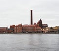 industrial brick building on the river bank