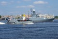 Landing craft D-67 with the boat of Peter the Great passes the Kazanets small anti-submarine ship