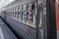 a modern long-distance train arrives on the platform. train car close-up