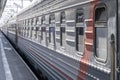 a modern long-distance train arrives on the platform. train car close-up