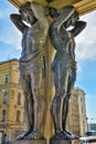 Atlantes cut from grey granite holding up the portico of the New Hermitage building in Saint Petersburg, Russia