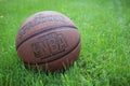Saint Petersburg, Russia - JUNE 05 2019: basketball ball on green grass. concept of NBA playoff final. spalding basketball backgro
