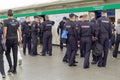 A group of policemen waiting into an underground subway car