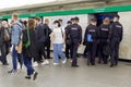 A group of policemen waiting into an underground subway car