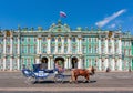 Saint Petersburg, Russia - June 2021: Horse carriage on Palace square with Hermitage museum at background Royalty Free Stock Photo