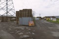 Industrial area and pallet warehouse with posters in Russian `buy pallets` Royalty Free Stock Photo