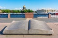 Saint Petersburg, Russia - June 2021: Open book monument on University embankment with St. Isaac`s cathedral at background Royalty Free Stock Photo