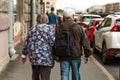 Saint Petersburg, Russia, 27 June 2019 - pair of elderly people walking down the street holding hands