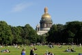 Saint Petersburg, Russia - June 25, 2016: People relaxing on the lawn next to St. Isaac Cathedral Royalty Free Stock Photo