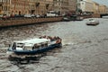 Saint Petersburg, Russia, 27 June 2019 - tourists ride on excursion boats on city water channels