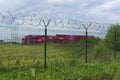Warehouse with red intermodal containers with the company logo `One`